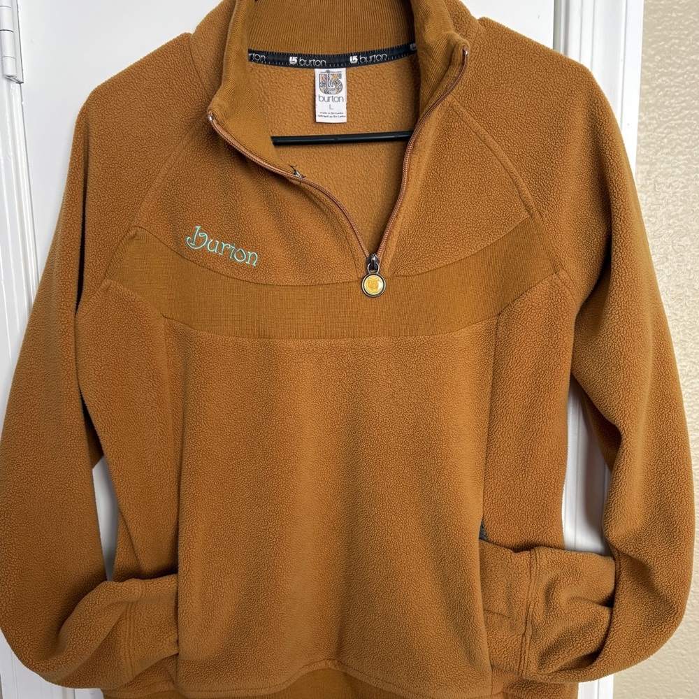 Women's Burton fleece quarter-zip pullover in a mustard yellow/brown color